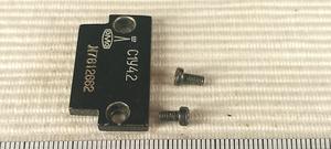 Lomo Biolam C1 (S1 1976) - zaślepka sprężyny ruchu pionowego z wygrawerowanym logo - ujęcie #2