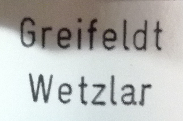 Logo producenta mikroskopów Greifeldt Wetzlar